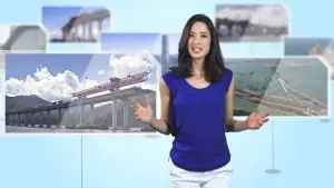 A woman in a blue sleeveless top and white pants stands with her hands slightly raised. Behind her, several images depict large construction projects, including bridges and aerial views of infrastructure. The background is a light blue gradient, making it resemble an animated construction video.