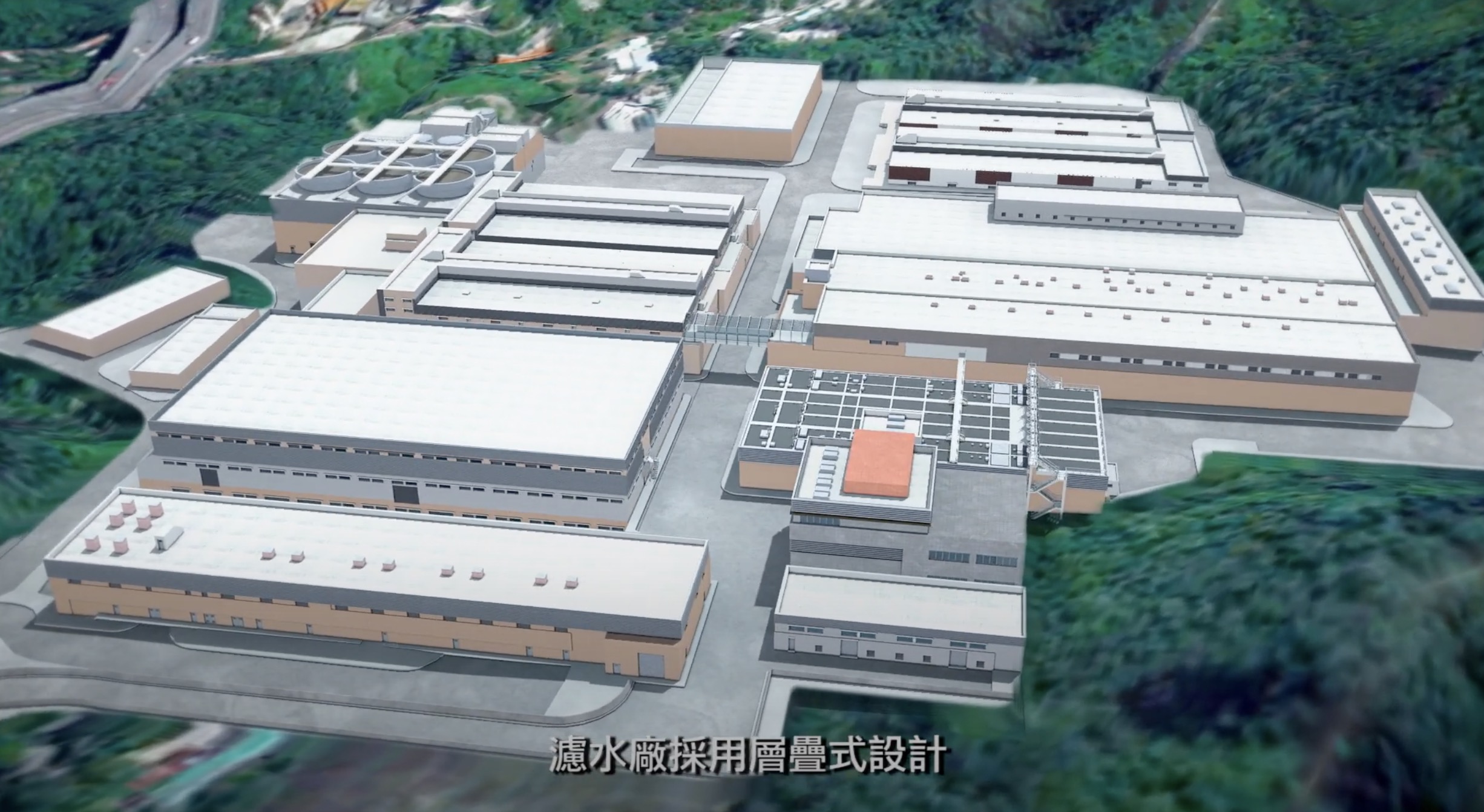 Aerial view of a large industrial facility with multiple rectangular buildings surrounded by greenery; Chinese text is overlaid at the bottom of the image.