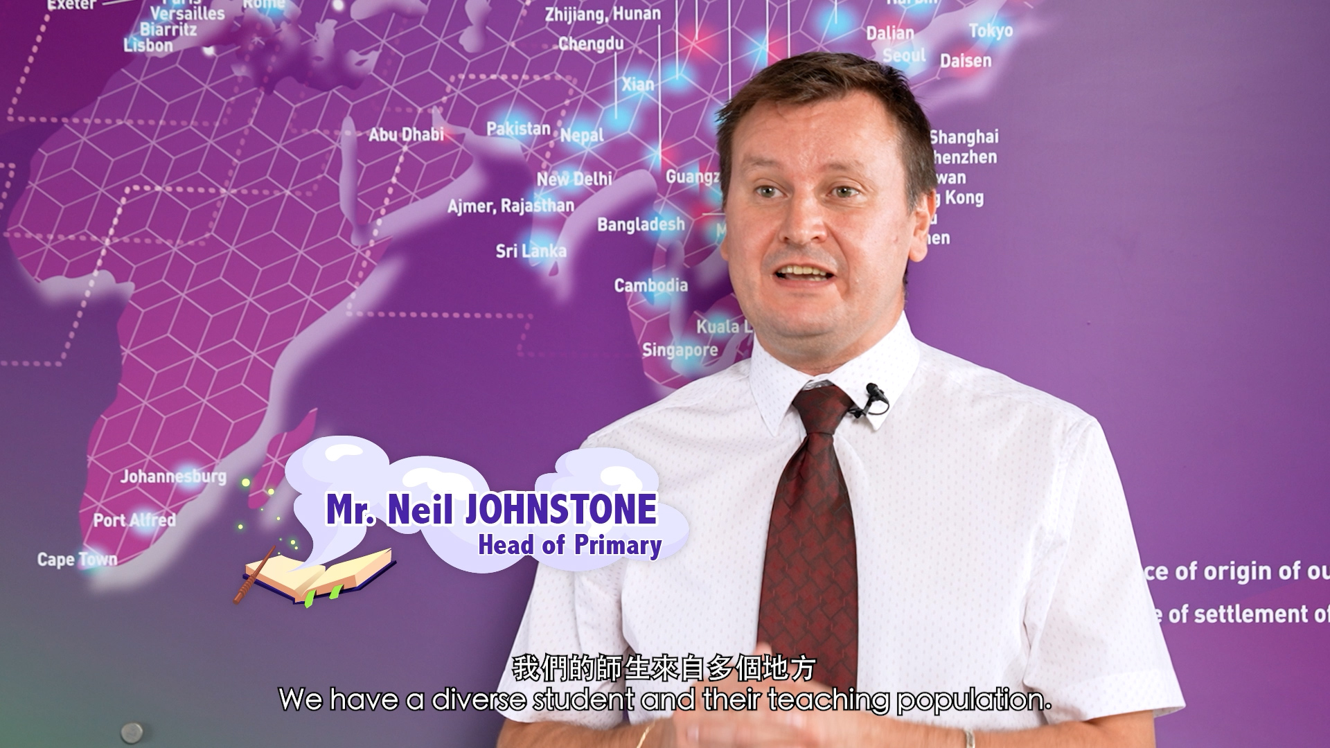 A man in a white shirt and tie stands in front of a purple world map. Text on the image reads "Mr. Neil Johnstone, Head of Primary." English and Chinese subtitles appear at the bottom.