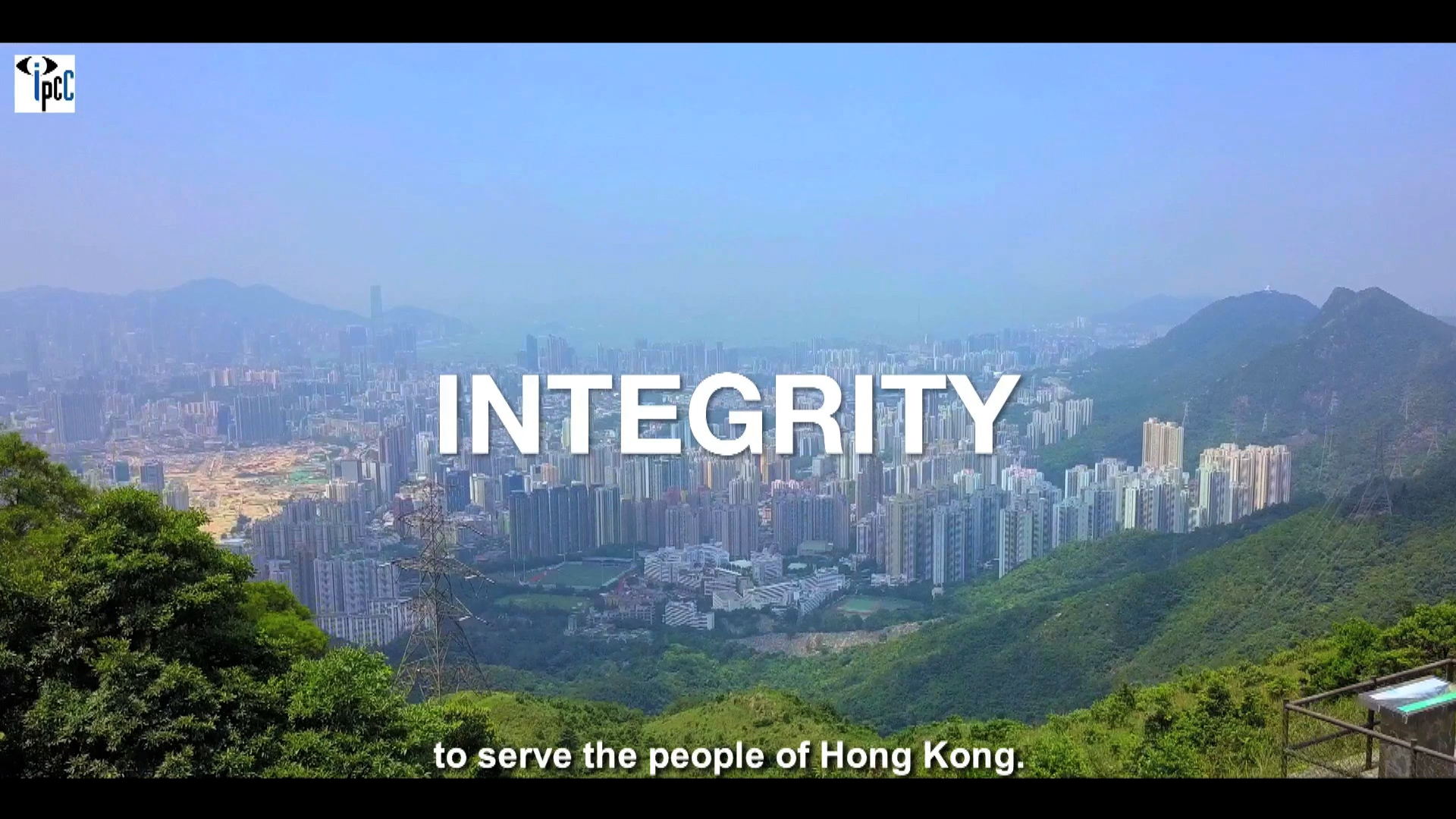 A panoramic view of Hong Kong’s cityscape and mountains, with the word “INTEGRITY” in large white text and the subtitle “to serve the people of Hong Kong.”.