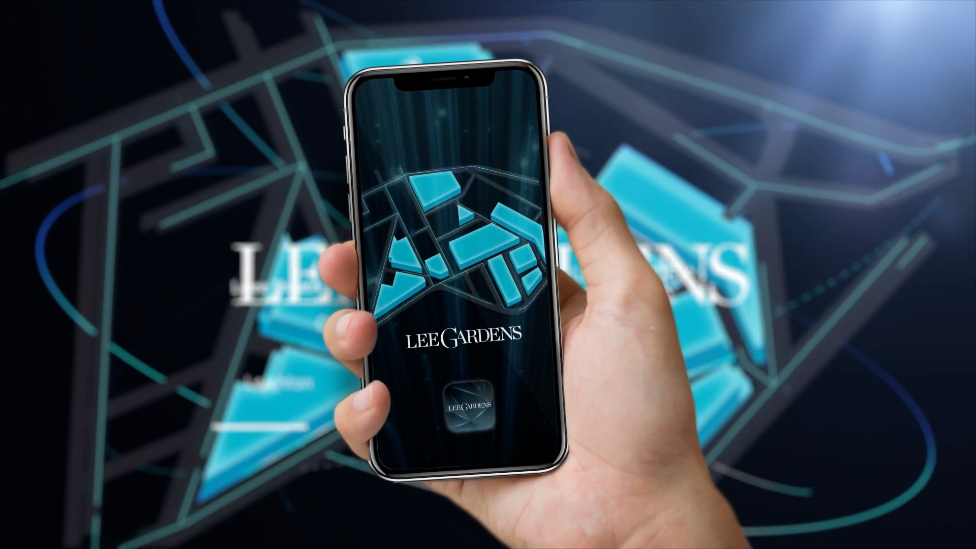 A hand holds a smartphone displaying the Lee Gardens app with a geometric blue design on the screen. The background features a blurred version of the same abstract design and the words "LEE GARDENS.